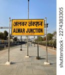 Small photo of Alwar, Rajasthan 16 Jan 2023: Alwar railway junction sign board in Hindi and English language