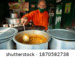 Small photo of New Delhi, India- December 8 2020: Kanta Prasad an owner of ' Baba Ka Dhaba' serving food in his small eatery in Malviya Nagar, Delhi.