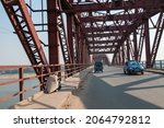 Small photo of Varanasi, Uttar Pradesh, India-Feb 6 2012: Traffic on a iron bridge at varanasi connect to mughalsarai to varanasi city. Malviya Bridge, inaugurated in 1887, originally called The Dufferin Bridge