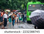 Small photo of New Delhi, India- Oct 8 2022: People thronging inside a local bus while others wait on the pavement of the road.