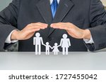 Small photo of Family life insurance, financial security concept : Businessman protects family members e.g parents and two child, depicts protection from insurer, they will pay a lump sum for clearing burden of debt