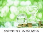 Small photo of Long-term investment to beat or hedge against inflation, financial planning concept : World globe map, hourglass or sand glass, coins on a table. Investing money or cash in assets to beat inflation.