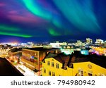 View of the northern light from the city center in Reykjavik, Iceland.