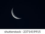 Small photo of Crescent moon in the dark blue night sky, natural background.