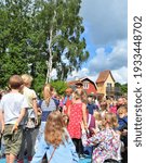 Small photo of People watching Pippi Longstocking performance at Astrid Lindgren's World theme park, Vimmerby, Sweden. Children's entertainment. Summer holiday. Space for copy.