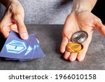 A concept image for investing in Non Fungible Tokens (NFTs) through Ethereum blockchain. These are rare digital items that are traded online. Image shows a woman holding NFTs with ETH coins