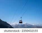 Small photo of Les Arcs 2000, France - 19-08-2023: A cable car from the Arcs 2000 ski resort is at a standstill in summer.