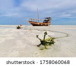 A Boat Anchor On The Beach In...