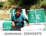 Small photo of Saada, YEMEN – September 10, 2020: Displaced people living on the slopes of the mountains receive humanitarian aid from a charitable organization