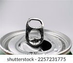 Close up Lid opens soft drink cans and drops of water.