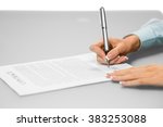Small photo of Woman signs business contract. Only a signature left. One siganture makes many changes. Think before you sign.