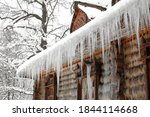 Icicles In Winter. The Old Hut...