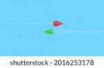 Small photo of Red and yellow paper planes flying in different directions, blue background. dissenting opinion, divergent views concepts