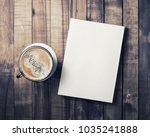 Blank book and coffee cup on vintage wood background. Responsive design template. Flat lay.