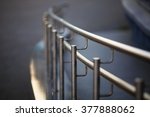 Chromium metal fence with handrail. Shallow depth of field. Selective focus.