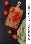 red tomato on a cutting board... | Shutterstock . vector #2077502098