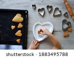 DIY making gingerbread by kid for Valentine's Day for parents. Baking training for children from 4 to 14 years old. early child development of fine motor skills. step by step. step 6. view from above