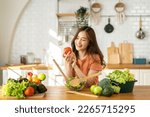 Small photo of Portrait of beauty body slim healthy asian woman having fun cooking and preparing cooking vegan food healthy eat with fresh vegetable salad in kitchen at home.Diet concept.Fitness and healthy food