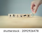 Small photo of Learning ecosystems concept. Building a blended learning ecosystems. Necessary for digital evolution and transformation. Hand holds wooden cubes with text"Learning Ecosystems"on grey background.
