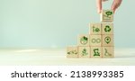 Small photo of Low carbon,carbon neutral concept. Net zero greenhouse gas emissions target. Climate neutral long term strategy. Hand put wooden cubes with decarbonization icon and green icon. Green banner. LCA. ISO.