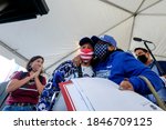Small photo of First time voter Salvadora Maria Roxanna, 73, greets her daughter, after casting her ballot at a vote center in Dodgers Stadium during the election day in Los Angeles, Tuesday, Nov. 3, 2020.