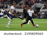 Small photo of Los Angeles FC midfielder Latif Blessing (7) drives the ball past D.C. United defender Antonio Alfaro (93) during an MLS soccer match Saturday, Aug. 16, 2022, in Los Angeles.