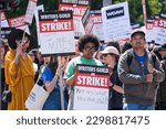 Small photo of Members of the The Writers Guild of America (WGA) picket outside Paramount Pictures on Friday, May 5, 2023, in Los Angeles.