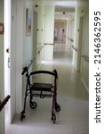 Small photo of Old age home. Frail care hallway with walking aid