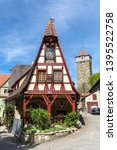 Small photo of Beautiful view of the historic Gerlach Blacksmith shop and the Roeder Gate Tower in the medieval town Rothenburg ob der Taube on a sunny day, Bavaria, Germany