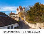 Beautiful view of the historic Thun castle on a sunny autumn day with beautiful sunshine abd blue sky cloud in background, Thun, Canton of Bern, Switzerland