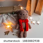 brown knitted teddy bear with a ... | Shutterstock . vector #1883882938
