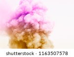 Colorful powder explosion.Colored cloud. Colorful dust explode.Paint Holi.Bomb smoke background,Smoke caused by explosions