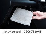 Small photo of Cabin Air Filter Replacement, Air filter in the cabin that is dirty after use for a while. Automotive air conditioning, check dust and amiss in car, Car care and maintenance concept.