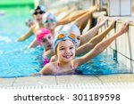 young and successful swimmers pose