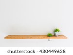 Wooden Shelf On White Wall With ...