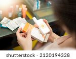 Small photo of woman read expire date on sunscreen packaging