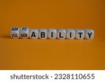 Small photo of Vulnerability or adaptability symbol. Turned wooden cubes and changed words vulnerability to adaptability. Orange background, copy space. Business, vulnerability or adaptability concept.