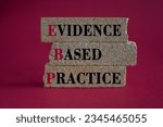 Small photo of Text EBP Evidence-based practice concept on brick blocks. Beautiful red background. Business concept.