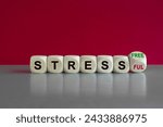 Small photo of Stress-free or stressful symbol. Turned a cube and changes the red words stressful to stress-free. Beautiful red background, grey table. Copy space, business and stress-free or stressful concept.