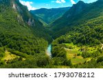 Small photo of Montenegro. Picturesque canyon of the Tara river.Mountains surrounding the canyon.Forests on the slopes of the mountains.Haze over the mountains.