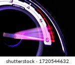 Close up shot of a speedometer in a car. At an engine speed of 6000 rpm on Car dashboard.Car Interior ilumination.