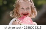 Small photo of Beautiful happy toddler child smiling, portrait neutral background. Impish smiling cute baby.