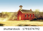 Small photo of Old Western Style School House & Church with a little wind Dustup