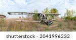 Small photo of The plundered AN-2 plane at the old abandoned airfield Volchansk. Panoramic photo. Local landmark.
