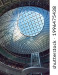 Small photo of New York, NY - June 17, 2021: Interior of Fulton Center with the dome, oculus and curved stairs. Fulton Center is a subway hub and retail complex in Lower Manhattan, NYC