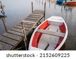 White And Red Boat Roped To The ...