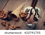 Ice cream sundae, waffle cone and walnuts
