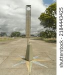 Small photo of Macapa, AP, Brazil - July 16th 2022: Marco Zero do Equador with the imaginary line crossing the two hemispheres and the Zerao Football Stadium in the background on a sunny day