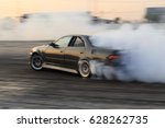 Race car drifting on speed track, Professional driver drifting car on race track with smoke, Abstract texture and background black tire tracks skid on asphalt road, Wheel tire tracks background.