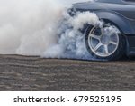 Drifting car, Sport car wheel drifting and smoking on track, Abstract texture and background black tire tracks skid on asphalt road, Wheel tire tracks background, Car tire track skid mark.